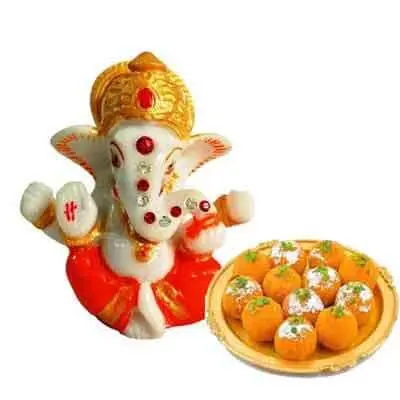 Lord Ganesh Idol with Laddu